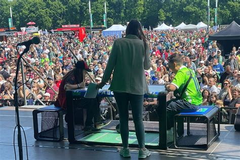 A Subsoccer match on a festival stage in front of a large crowd